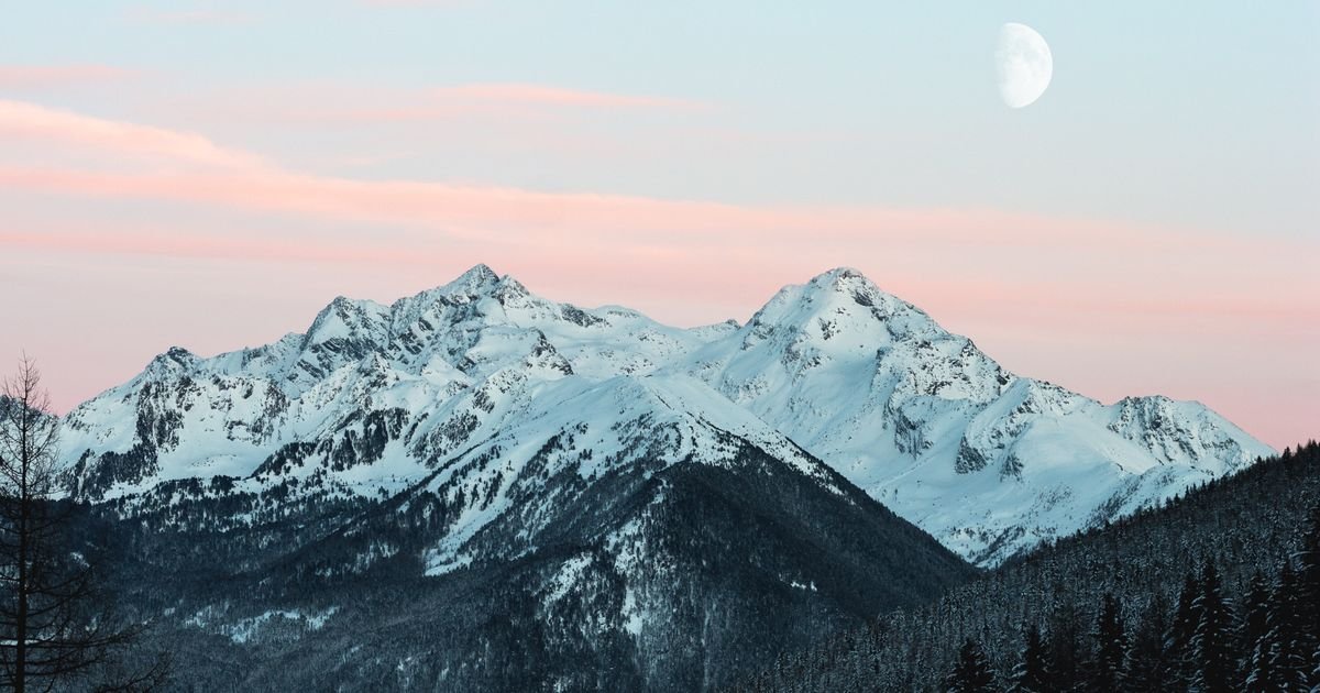 Snow-covered mountain landscape in a temperate climate region